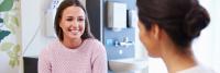 Doctor talking with teenage female patient